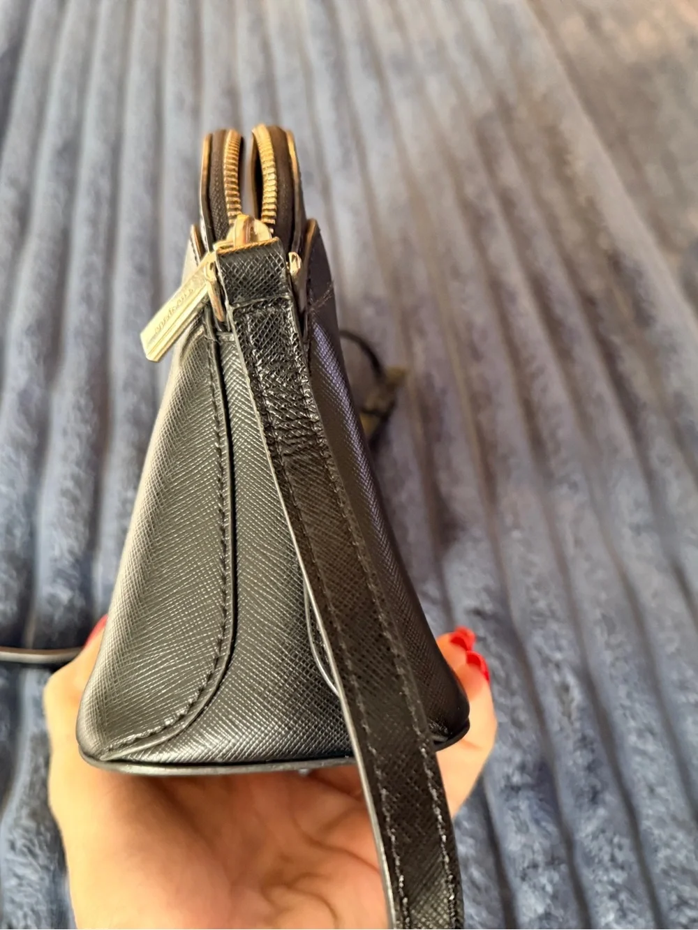 Kate Spade New York Payton Dome Crossbody in black saffiano leather.